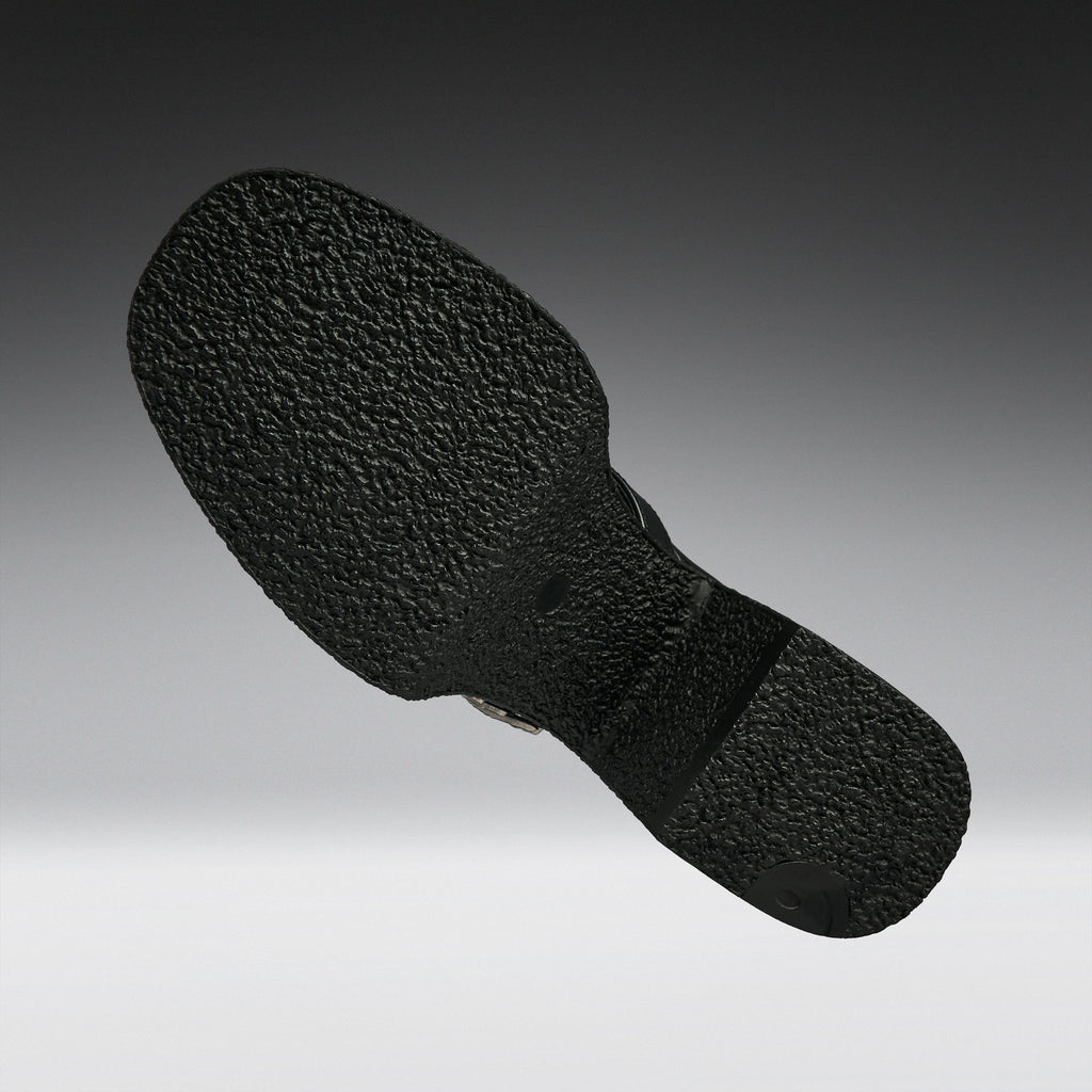 A close-up of a black textured shoe sole, shown floating against a gradient gray background.