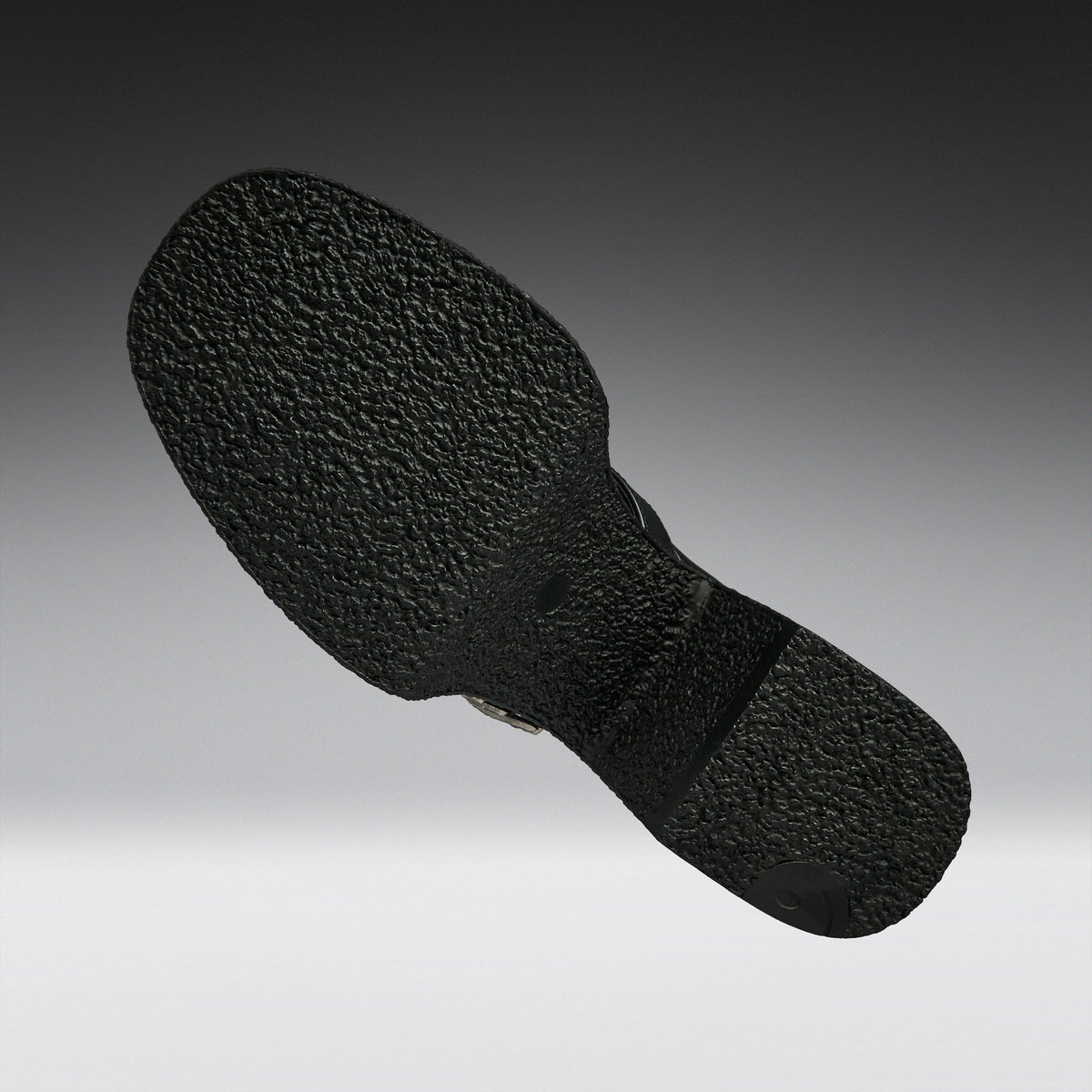 A close-up of a black textured shoe sole, shown floating against a gradient gray background.