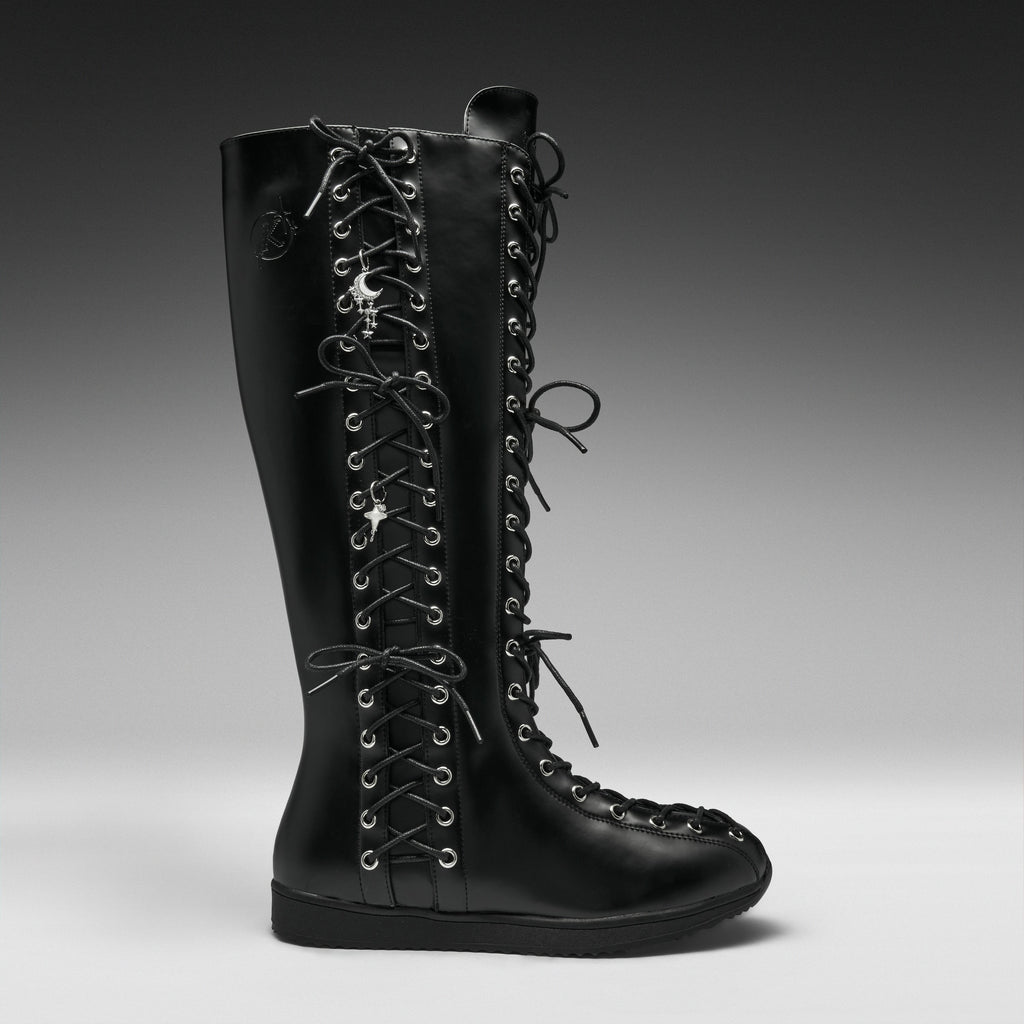 A single black leather knee-high lace-up boot with silver metal eyelets and decorative skull-and-crossbones laces, shown in profile against a dark gray studio background.