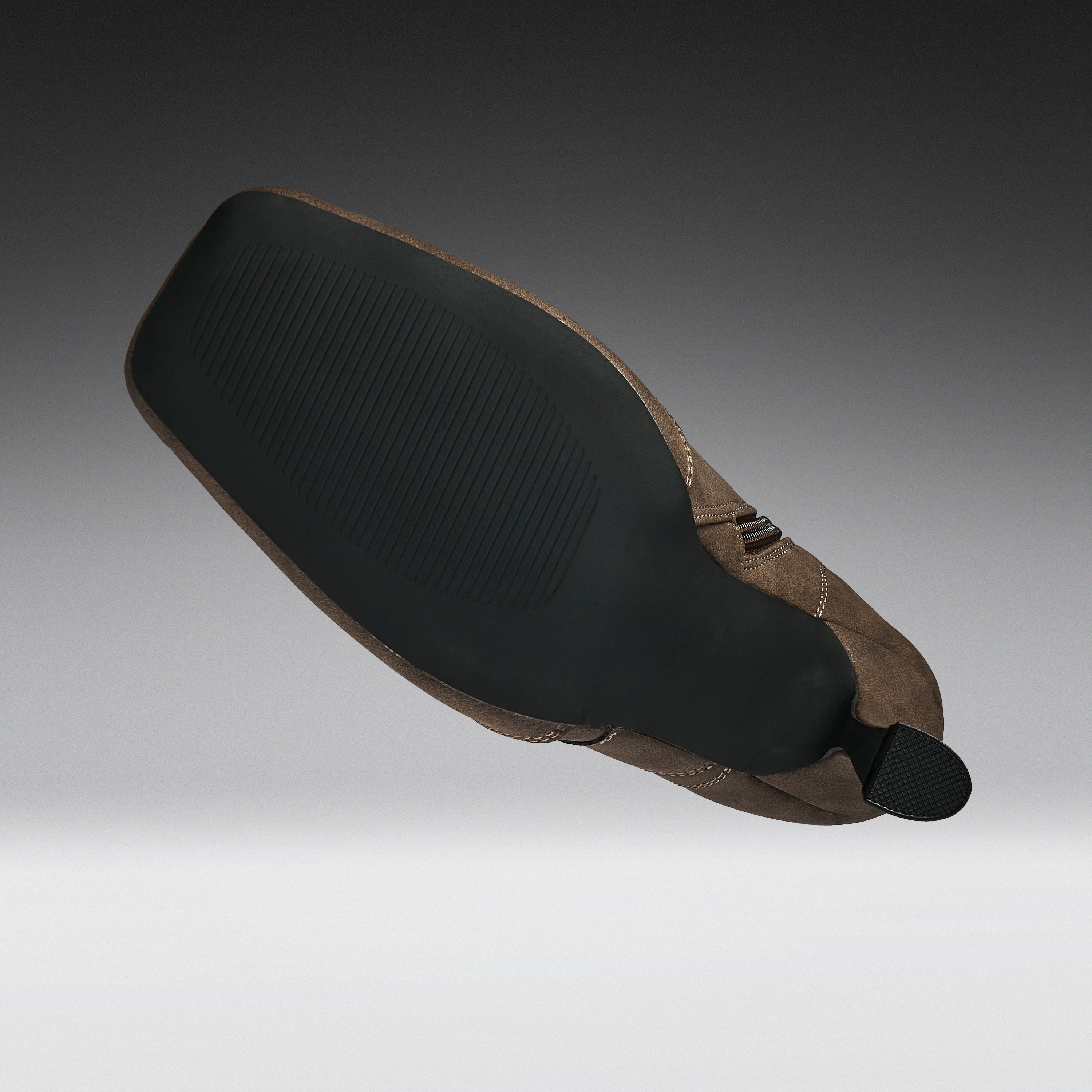 A motorcycle or bicycle leather saddle with a black textured rubber seat pad and a brown leather body, shown floating against a gradient gray background.