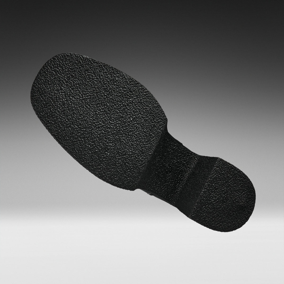 A black textured shoe sole shown floating against a gradient gray background.
