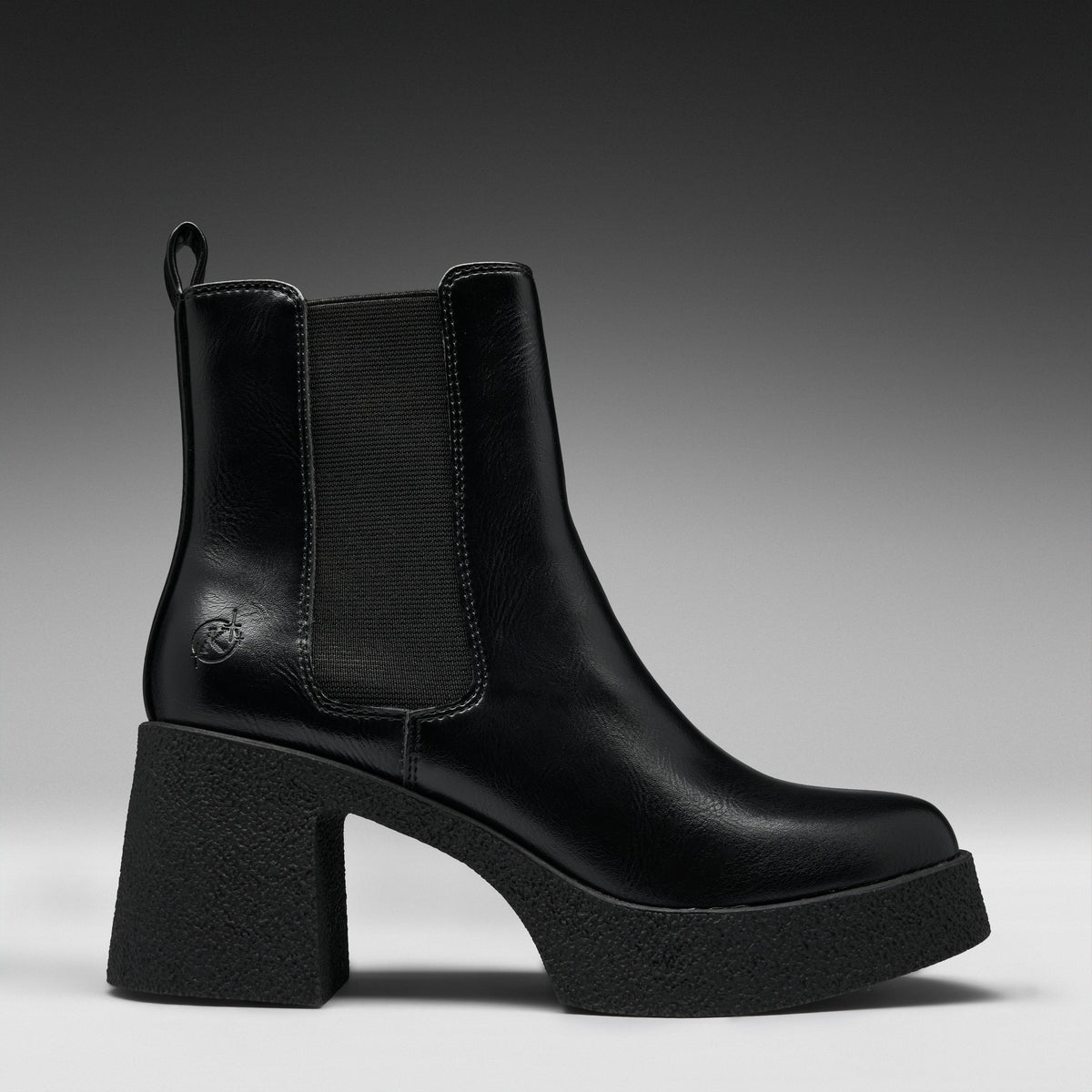 A black leather ankle boot with a chunky block heel and platform sole, featuring a black elastic side panel and a small embossed logo on the side.